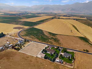 Birds eye view of property featuring a mountain view and a rural view