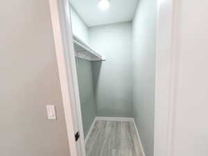 Walk in closet in the primary bedroom