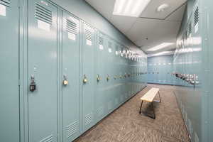 Hall featuring a paneled ceiling