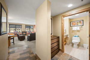 Interior space featuring toilet and tile patterned floors