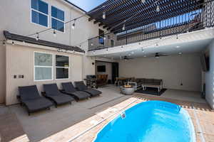 View of swimming pool featuring an outdoor living space and a patio