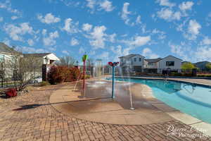 View of pool featuring pool water feature