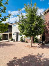 View of front of property with a balcony