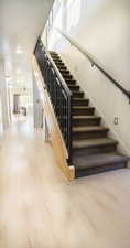 Stairway with hardwood / wood-style flooring