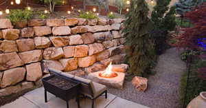 View of yard with a fire pit