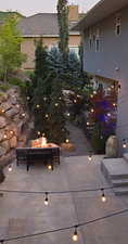 Patio terrace at dusk with a fire pit