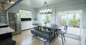 Dining room with light hardwood / wood-style floors