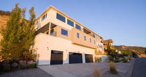 Exterior space featuring a garage and a mountain view