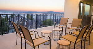 Balcony at dusk with a water view