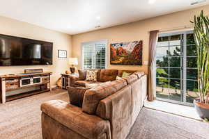 Living room featuring light carpet