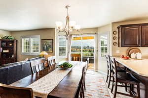 Dining area featuring a chandelier and light tile patterned floors