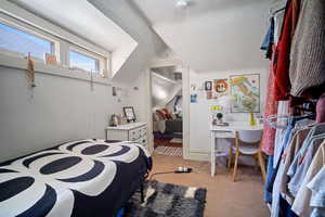 Bedroom with light colored carpet