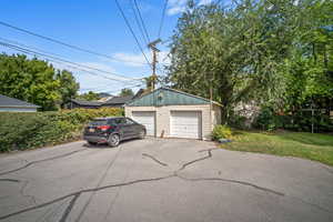 Garage featuring a yard