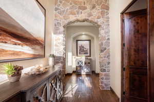 Corridor featuring dark hardwood / wood-style flooring