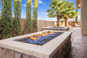 View of pool featuring an outdoor fire pit and a patio area