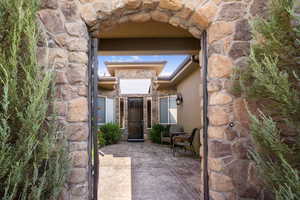 View of exterior entry featuring a patio