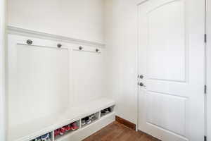 Mudroom featuring dark wood-type flooring