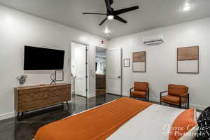 Bedroom featuring a textured ceiling, ceiling fan, and an AC wall unit