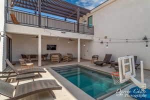 View of swimming pool with an outdoor living space and a patio area