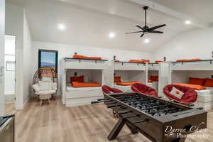 Interior space featuring lofted ceiling with beams, light hardwood / wood-style flooring, and ceiling fan