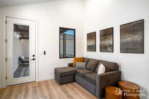 Living room featuring light hardwood / wood-style flooring and vaulted ceiling