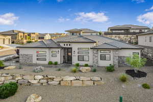 Rear view of property with a garage