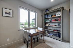 Home office featuring carpet flooring