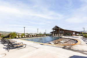 View of swimming pool with a patio area