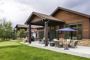 Rear view of house featuring outdoor lounge area and a patio