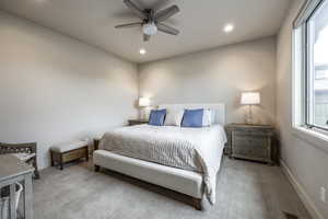 Bedroom featuring light carpet and ceiling fan