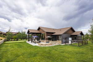 Rear view of property with a patio and exterior kitchen