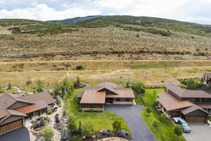 Birds eye view of property with a mountain view