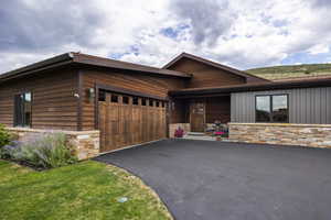 View of front facade featuring a garage