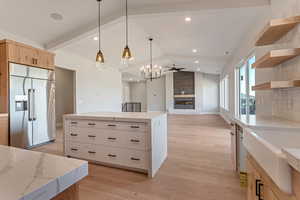 (This owner added a farm sink and waterfall countertops to their island)