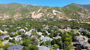 Birds eye view of property with a mountain view