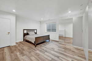 Bedroom with light wood-type flooring