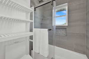 Bathroom with toilet and an enclosed shower