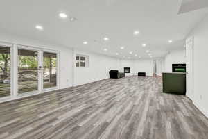 Unfurnished living room featuring wood-type flooring