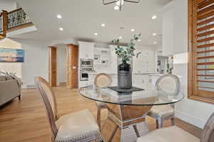 Dining space featuring light wood-type flooring and ceiling fan