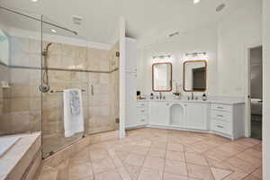 Bathroom with vanity, independent shower and bath, and tile patterned flooring