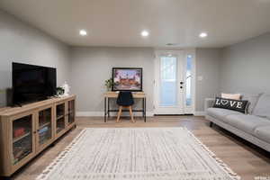 Basement unit great room and exterior entrance.