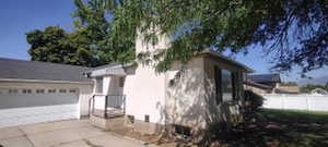 View of side of property featuring a garage