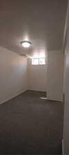 Unfurnished room with carpet floors