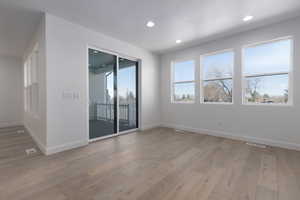 Unfurnished room with wood-type flooring