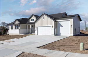 View of front facade featuring a garage