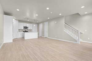 Unfurnished living room featuring light hardwood / wood-style flooring