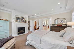 Carpeted bedroom featuring ornamental molding