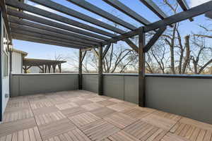 Wooden terrace featuring a pergola