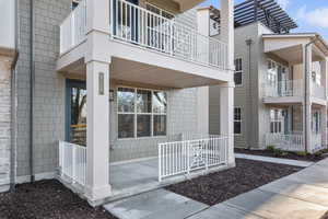 Entrance to property with a balcony