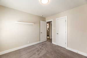 Unfurnished bedroom featuring carpet floors